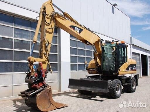 Экскаватор колесный Caterpillar m315C cтёкла