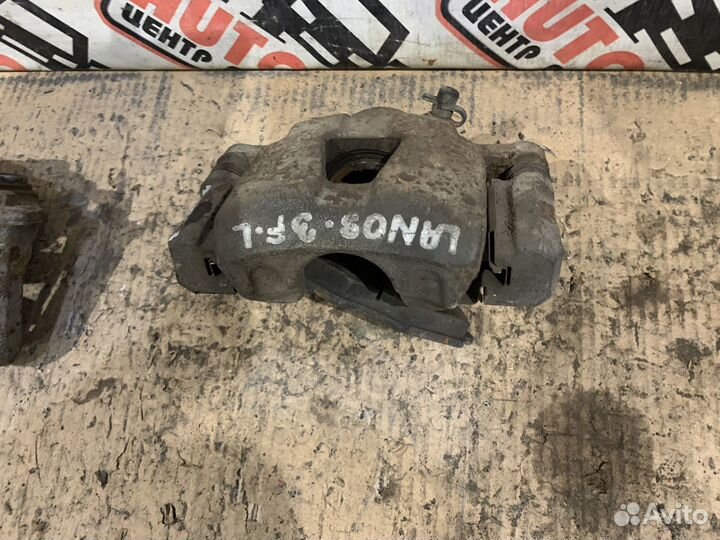 Суппорт передний левый правый Chevrolet Lanos