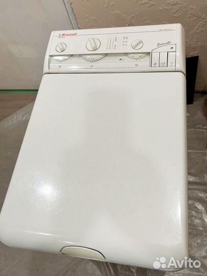 Стиральная машина с вертикальной загрузкой Brandt