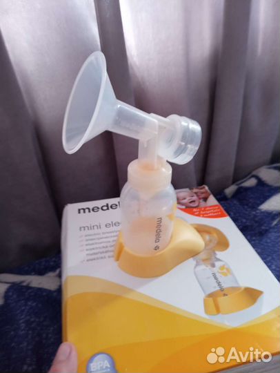 Молокоотсос medela электрический