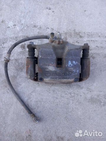 Суппорт тормозной передний правый Мазда 3 BM