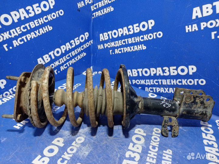 Передняя левая стойка амортизатора Mazda 626 седан