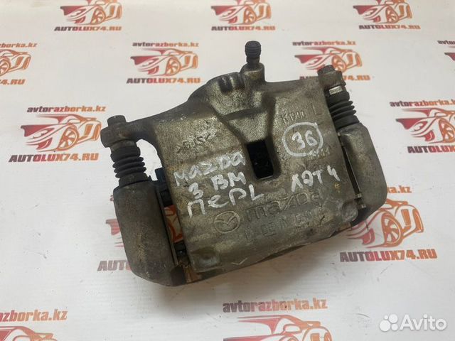 Суппорт тормозной передний левый Mazda 3 BM