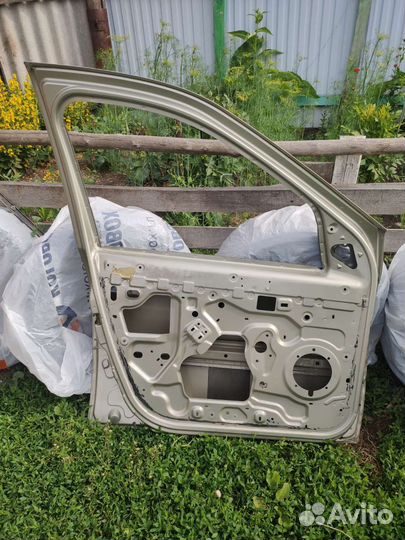 Дверь водительская renault logan1