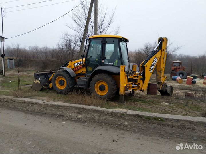 Услуги экскаватора-погрузчика