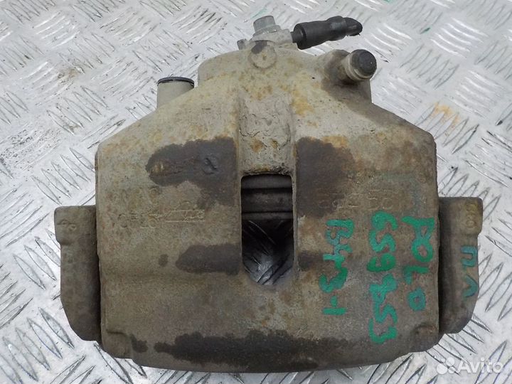 Суппорт тормозной передний левый на Volkswagen Pol