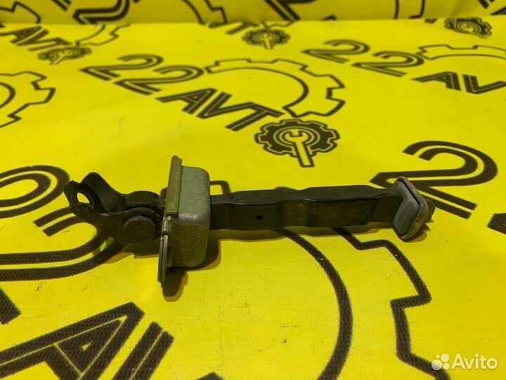 Ограничитель двери задний левый Nissan Primera