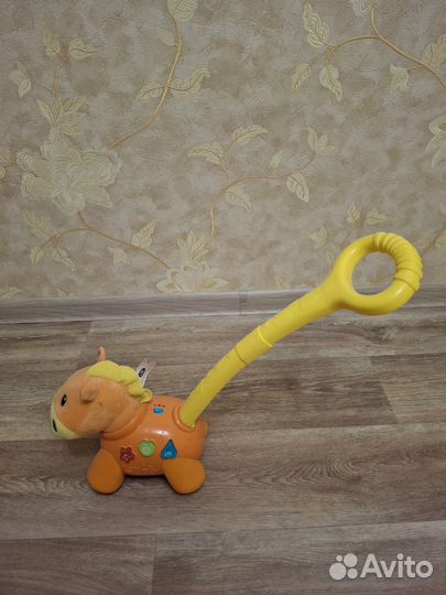 Игрушка каталка с ручкой