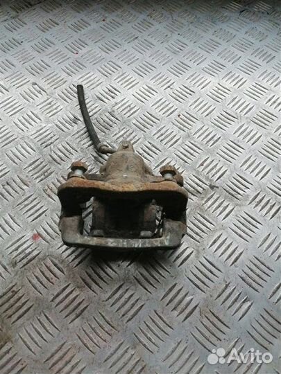 Суппорт тормозной задний левый Ssangyong Actyon