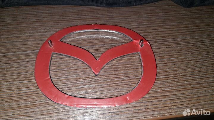 Эмблема мазда