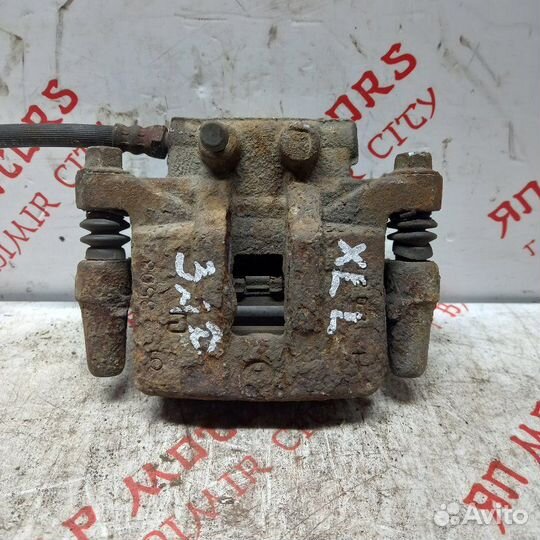 Суппорт тормозной задний левый Mitsubishi