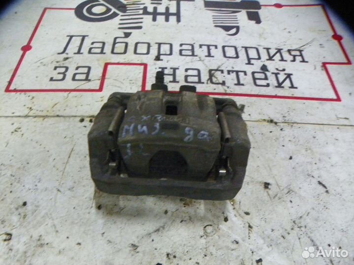 Суппорт тормозной задний левый Mazda CX-7