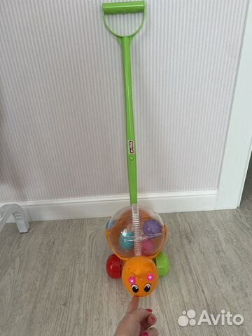 Игрушка каталка с ручкой