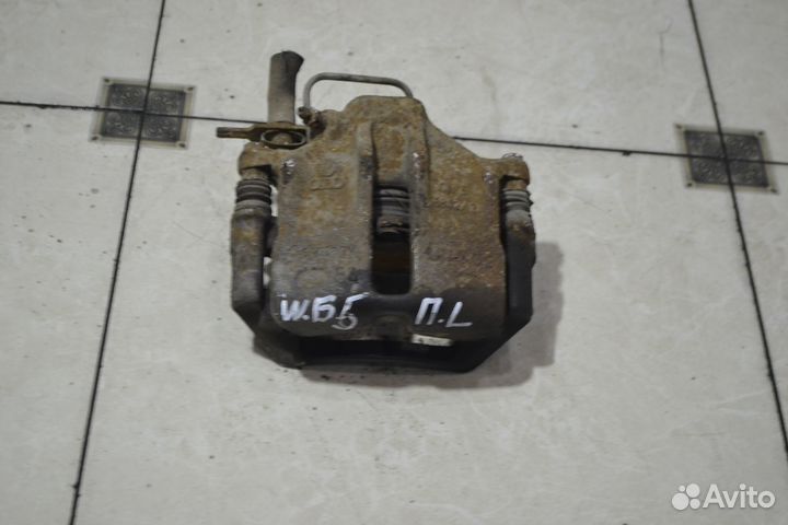 Тормозной суппорт перед лев Volkswagen Passat B5