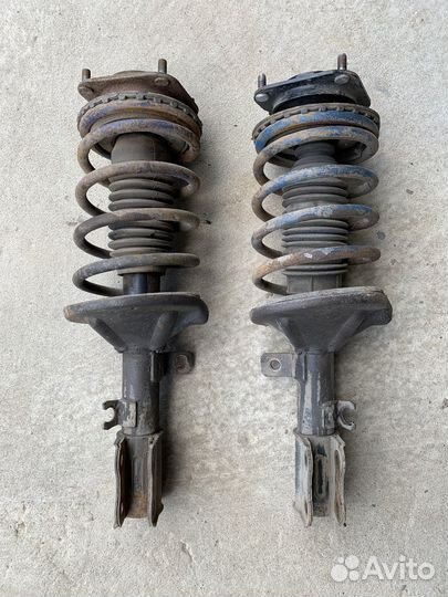 Стойка амортизатора передняя правая Kia Spectra