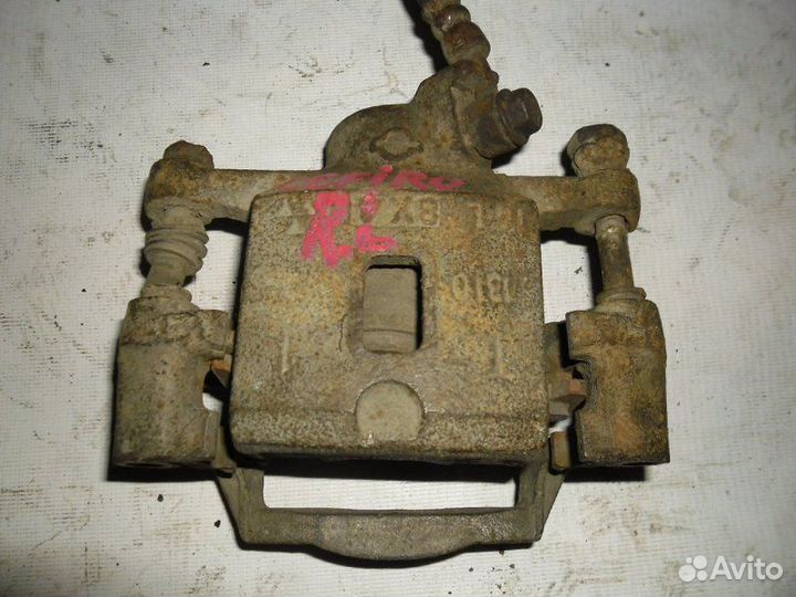 Суппорт тормозной задний левый Nissan Cefiro ECA31