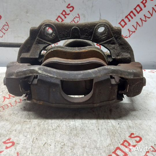 Суппорт тормозной передний левый Peugeot 207 EP6