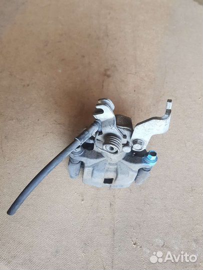 Суппорт тормозной задний правый Мазда 6GH