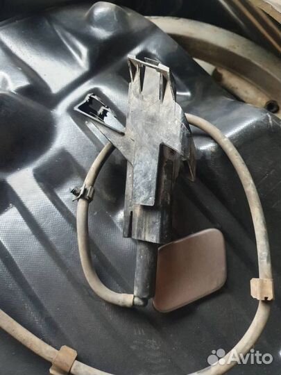 Форсунка омывателя фар левая