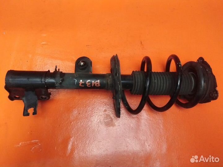 Стойка амортизатора передняя левая Nissan