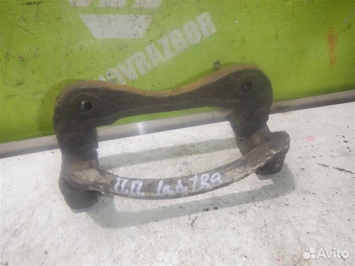Скоба суппорта переднего Хендай Лантра 96-00