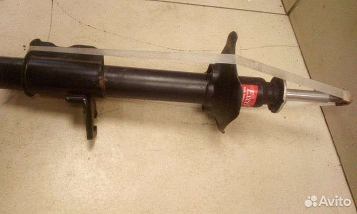 Амортизатор задний левый Nissan Sunny
