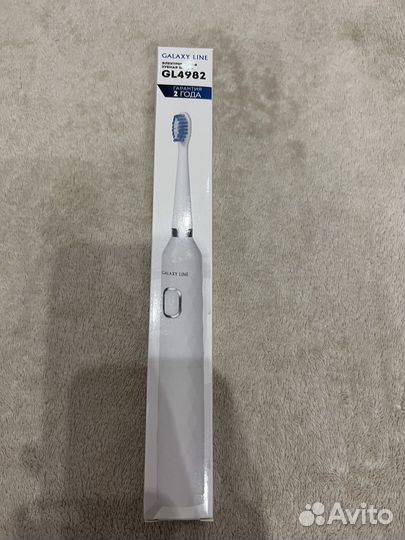 Электрическая зубная щетка