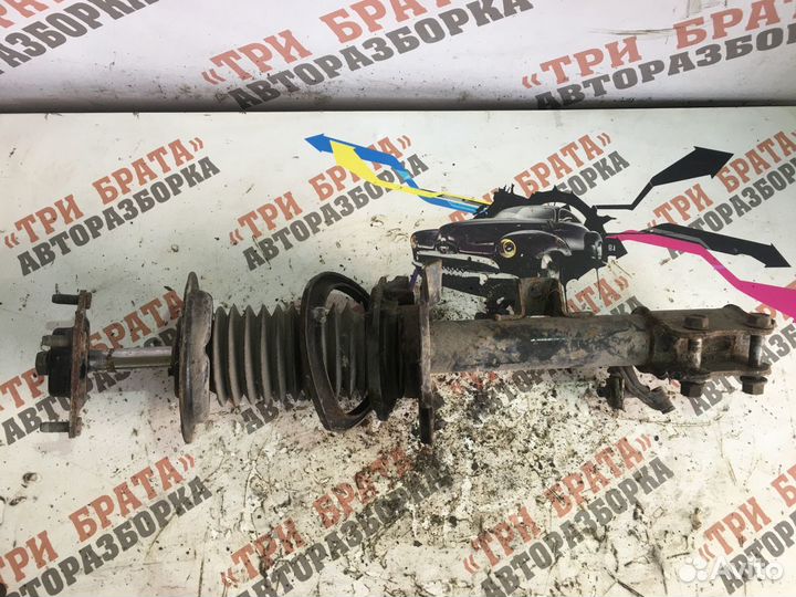 Мазда Трибьют Амортизатор передний левый Лев