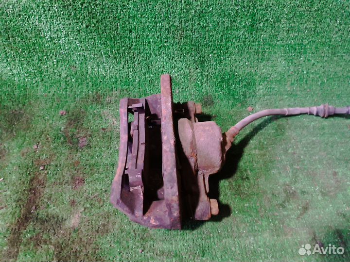 Суппорт тормозной передний Kia Spectra I рестайлин