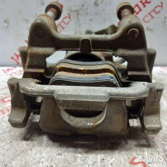 Суппорт тормозной задний левый Volkswagen Touran