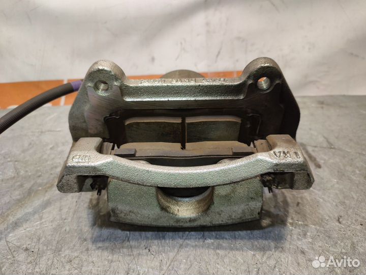 Суппорт тормозной передний левый Kia Sportage 5