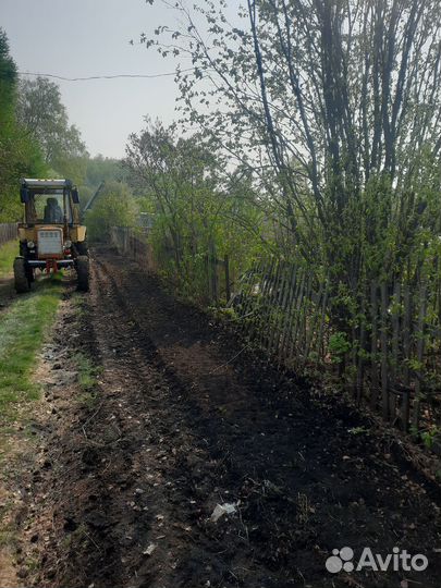 Вспашка земли трактором фреза,плуг