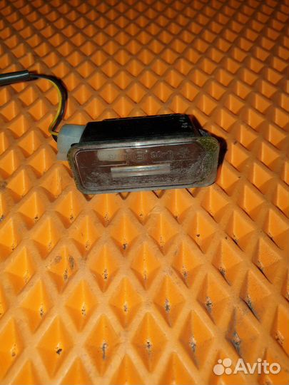 Фонарь подсветки номера Ford Focus