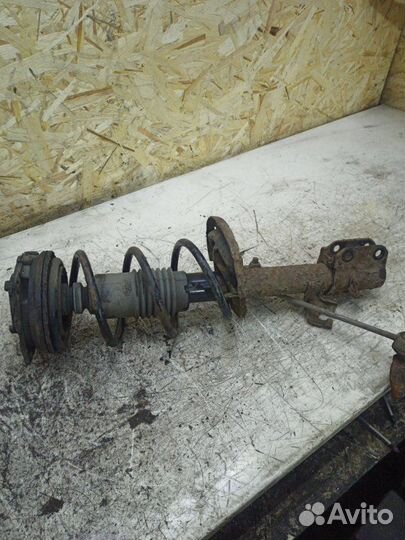 Стойка подвески передняя левая Nissan Note минивэн