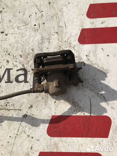 Суппорт тормозной задний левый Land Rover Freeland