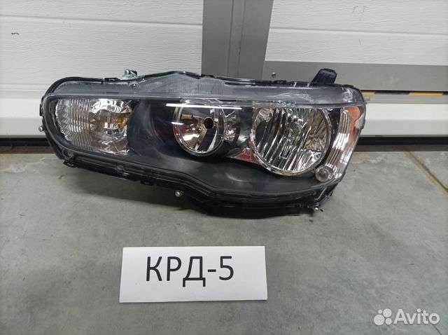 Фара левая Lancer X