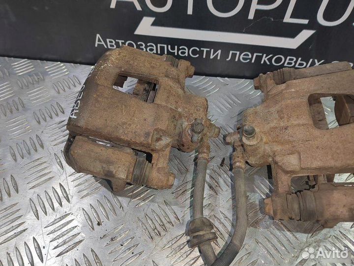 Суппорт левый Chevrolet Aveo T250 1.2