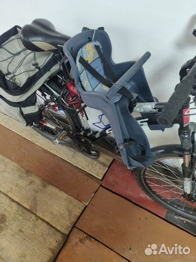 Дорожная сумка и детское кресло на велосипед