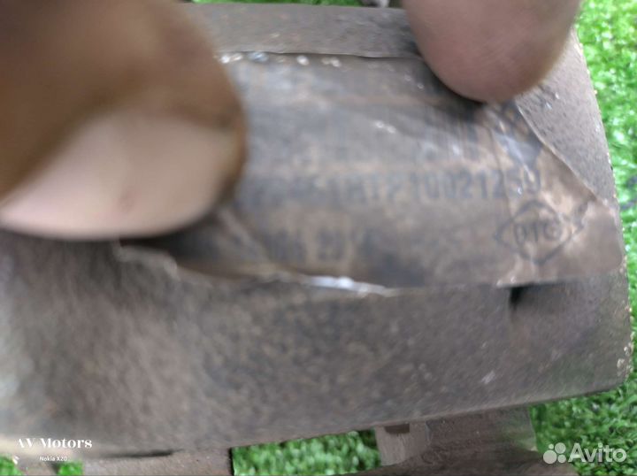 Суппорт тормозной передний Nissan Almera G15