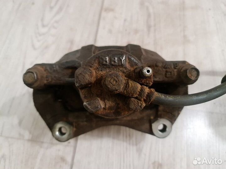 Суппорт передний левый Mitsubishi Lancer 10 CX3A