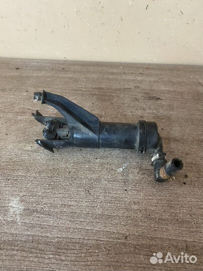 Форсунка омывателя фары левая Note (E11)