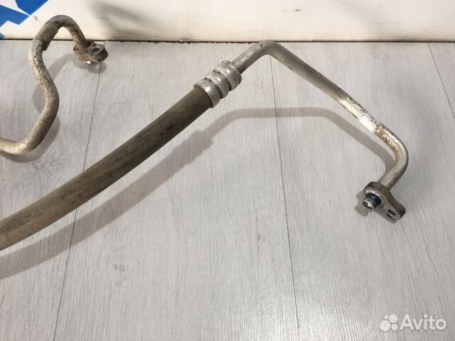 Трубка кондиционера длинная KIA RIO 2 JB рест 1.6