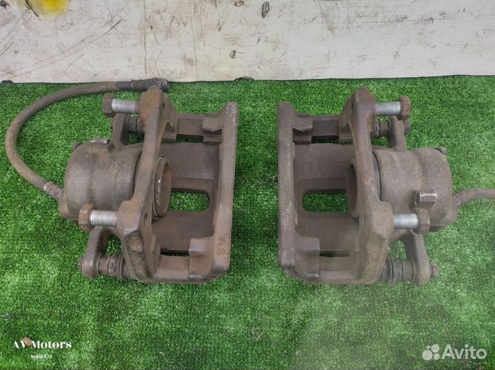 Суппорт тормозной передний Nissan Almera G15