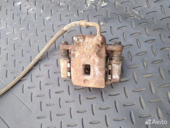 Суппорт тормозной задний левый задний левый Ssang