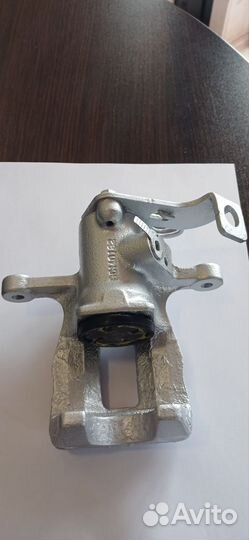 Суппорт тормозной задний левый solaris