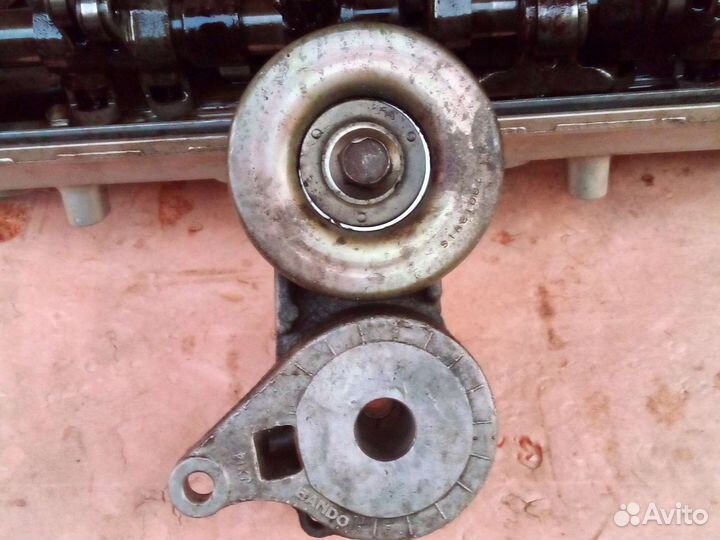 Натяжитель ремня 4g69