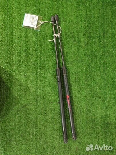 Амортизатор багажника задний Mazda Demio DY3W