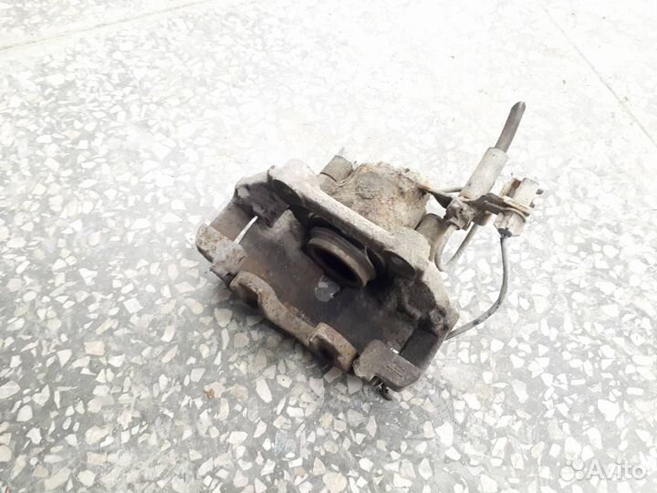 Суппорт тормозной передний левый Volkswagen Passat