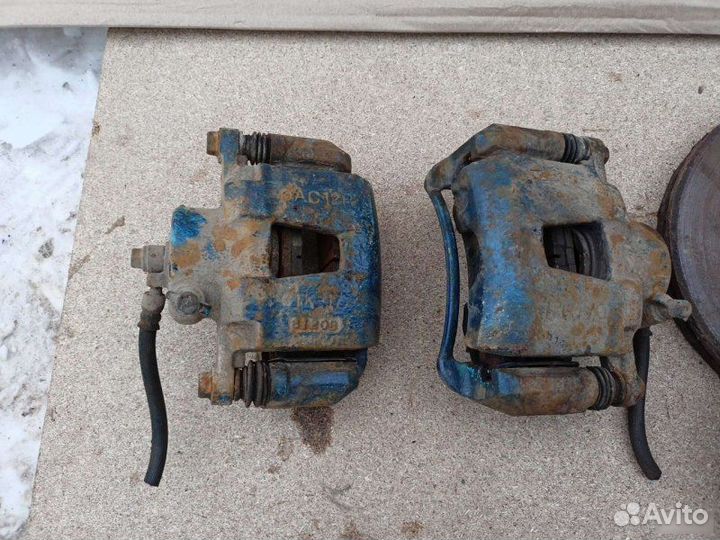 Суппорт тормозной передний Chevrolet Lacetti