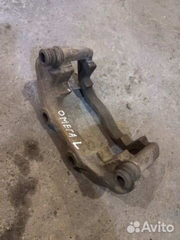 Скоба Тормозного Суппорта Опель Омега Б Левая